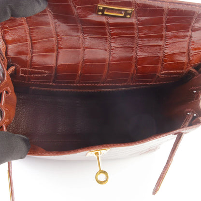 HERMÈS Kelly Ado PM Miel Shiny Alligator Gold hardware