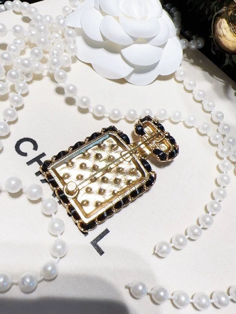 Chanel 23A quilted chain perfume bottle brooch
