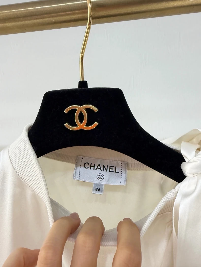 Chanel 24S ecru bow-tie satin off-the-shoulder blouse