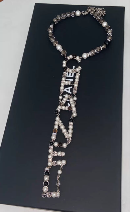 Chanel 19k Snow Collection Glass Letter Pearl Necklace