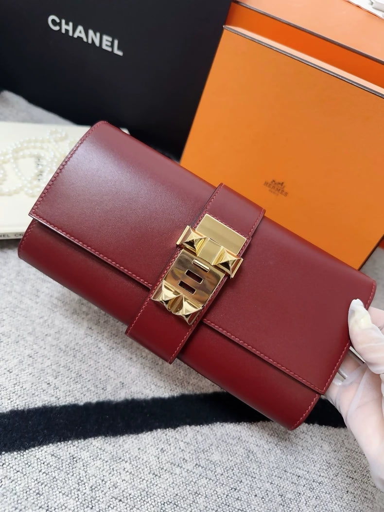 Hermes red Medor clutch gold hardware