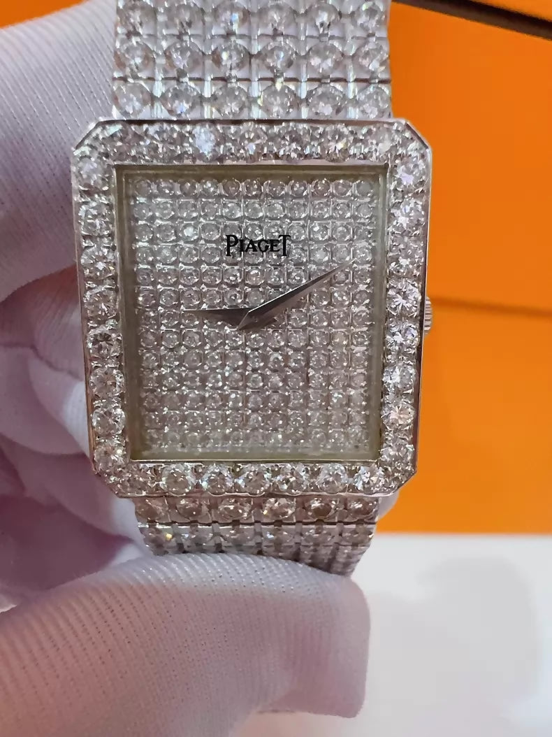 Vintage Piaget men's watch with diamond-set bezel and bracelet, quartz movement