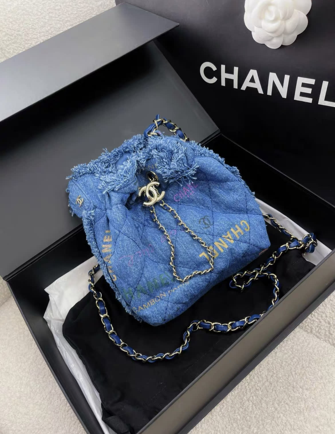 CHANEL Chanel Blue Denim Logo Printed Quilted Mini Mood Bucket Bag Gold Hardware, 2022 - Small Bucket Bag - Secondhand luxury from Wararni