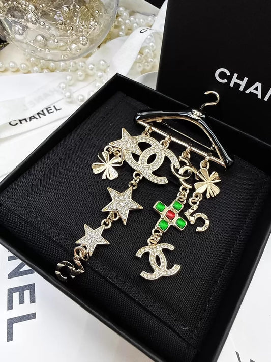 Chanel 23C black and gold hanger brooch