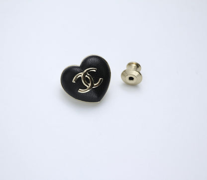 CHANEL Chanel Vintage 22K Pale Gold Metal And Black Leather Heart Shape Round Buckle Brooch - Onesize Fashion Jewellery - Vintage fashion from Wararni