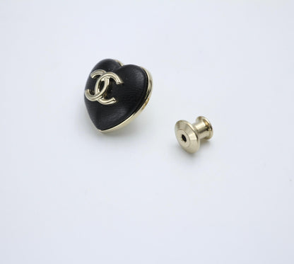 Chanel Vintage 22K Pale Gold Metal And Black Leather Heart Shape Round Buckle Brooch