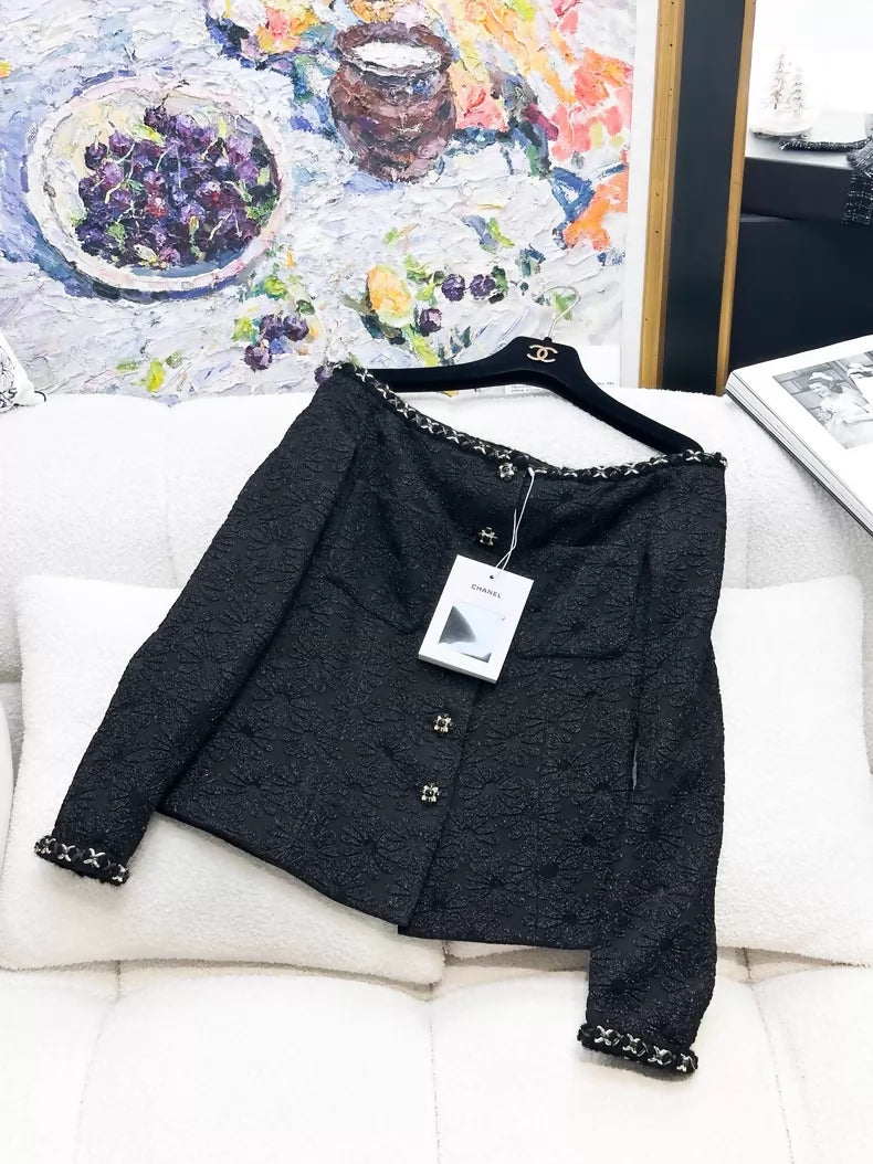 Chanel 21A black off-the-shoulder tweed jacket