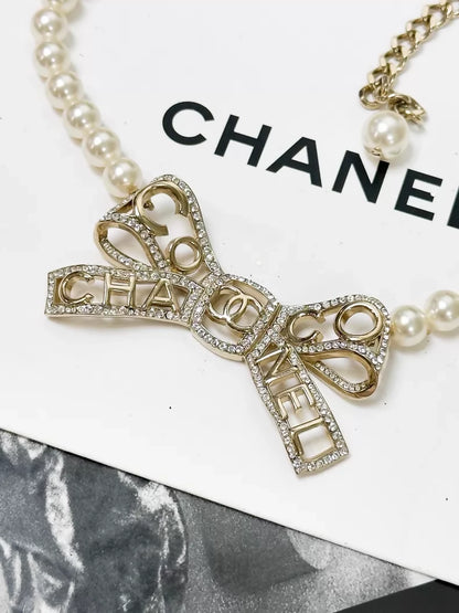 Chanel Fall/Winter 2020 Gold rhinestone bow pearl necklace choker