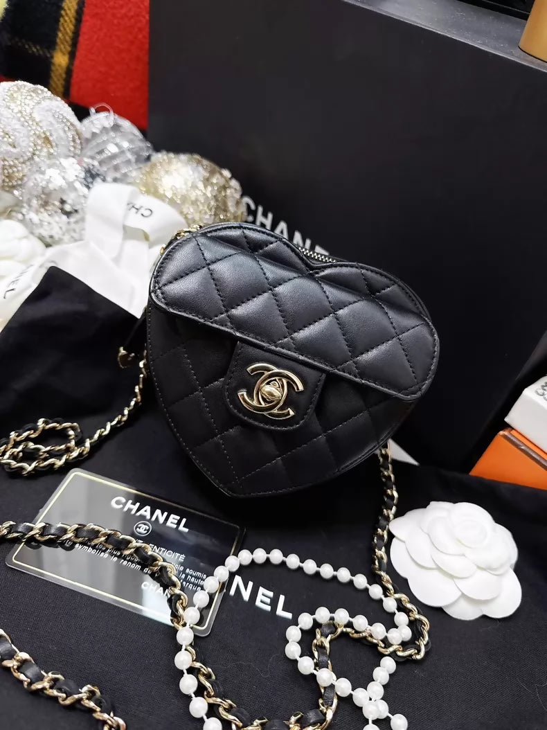 Chanel 22S black and gold quilted heart-shaped crossbody bag