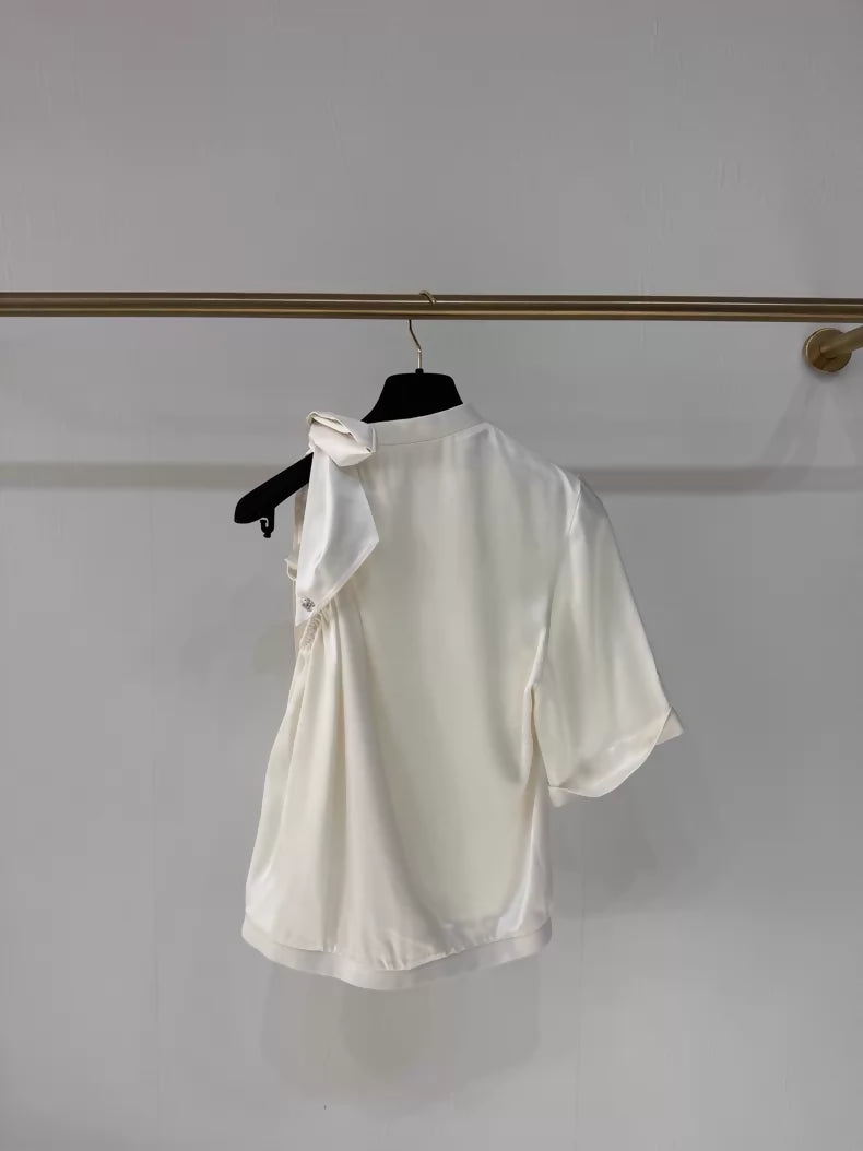 Chanel 24S ecru bow-tie satin off-the-shoulder blouse