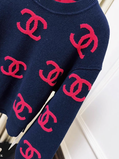 Chanel 21p navy blue and pink CC sweater
