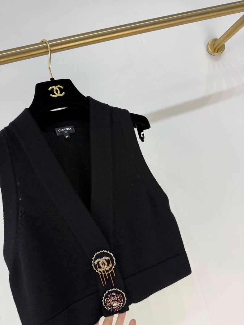 Chanel 22A black knitted vest with charms