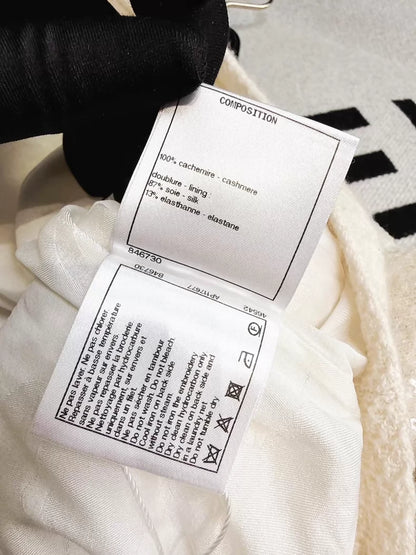 Chanel 21S  off-white knit cardigan with heavy embroidery, sequined camellia