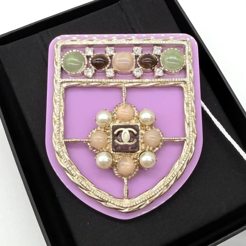 Chanel purple acrylic shield brooch