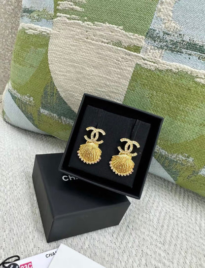 Chanel 23C gold shell earrings