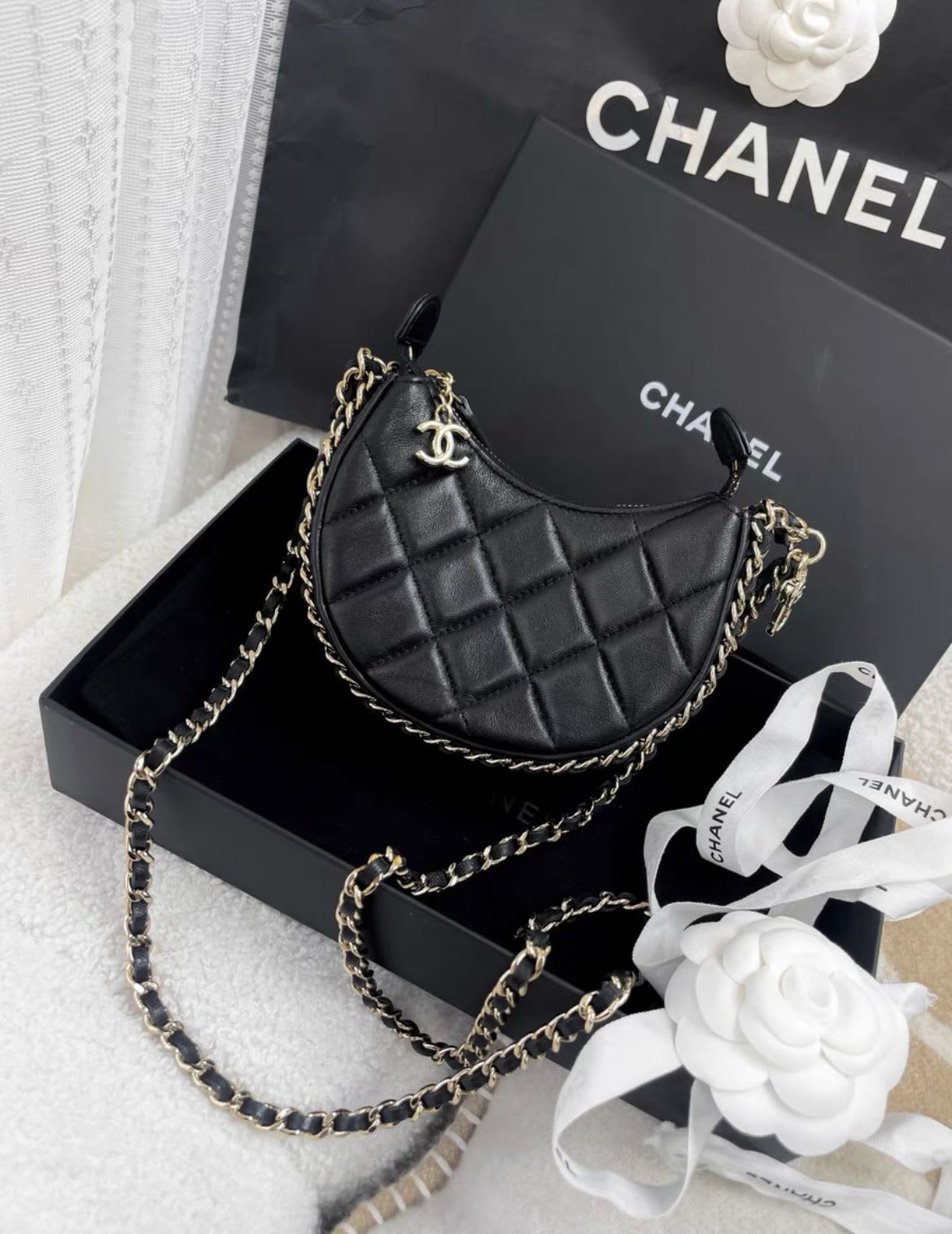 CHANEL Chanel 23 black gold mini moon bag - Mini Crossbody Bag - Secondhand luxury from Wararni