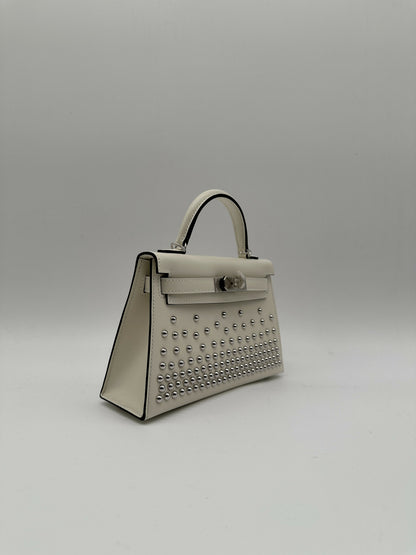 Hermès Kelly 20 Clouté Cream PHW G 2026