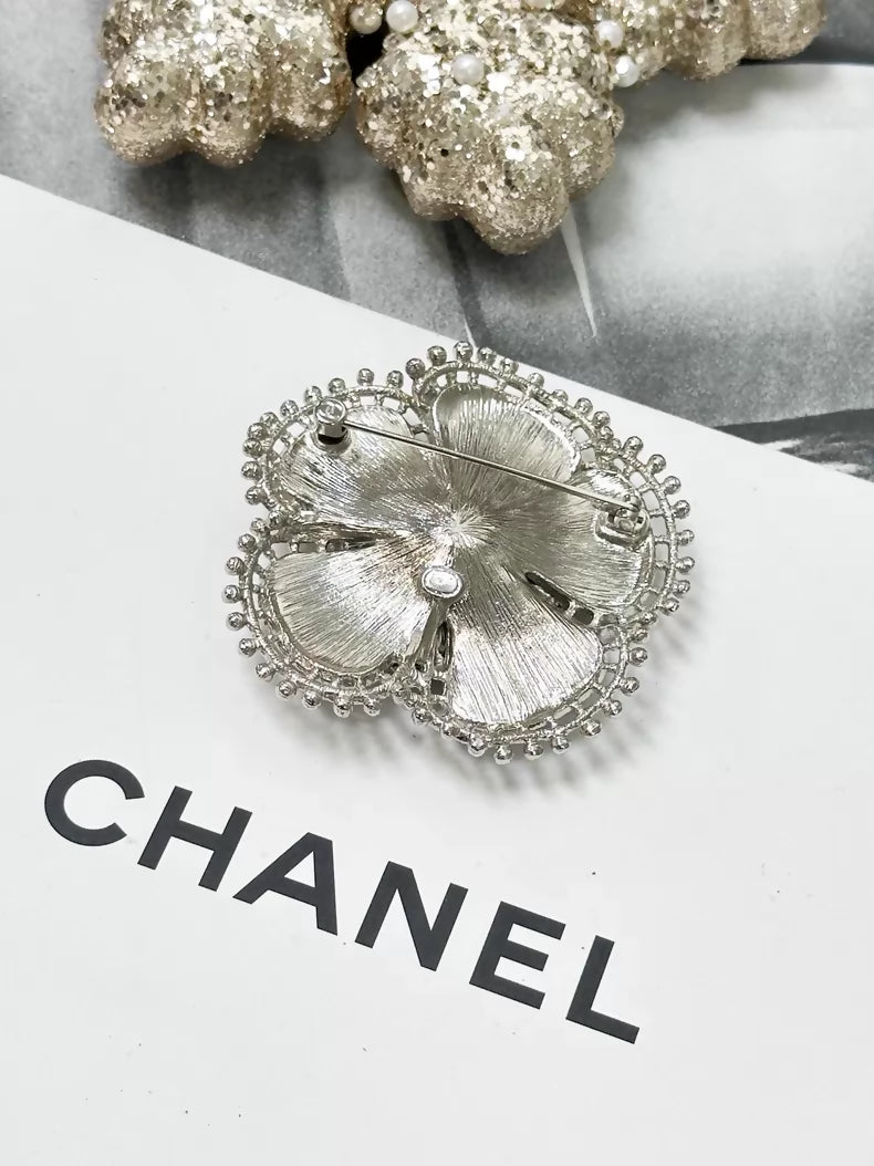 Chanel Fall/Winter 2023 black and silver pearl double C logo camellia brooch