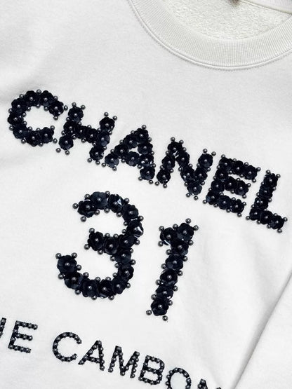 Chanel 20A ecru camellia sweater