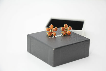 Chanel 03P Enamel Orange Five-Petal Flower Green CC Stacked Earrings