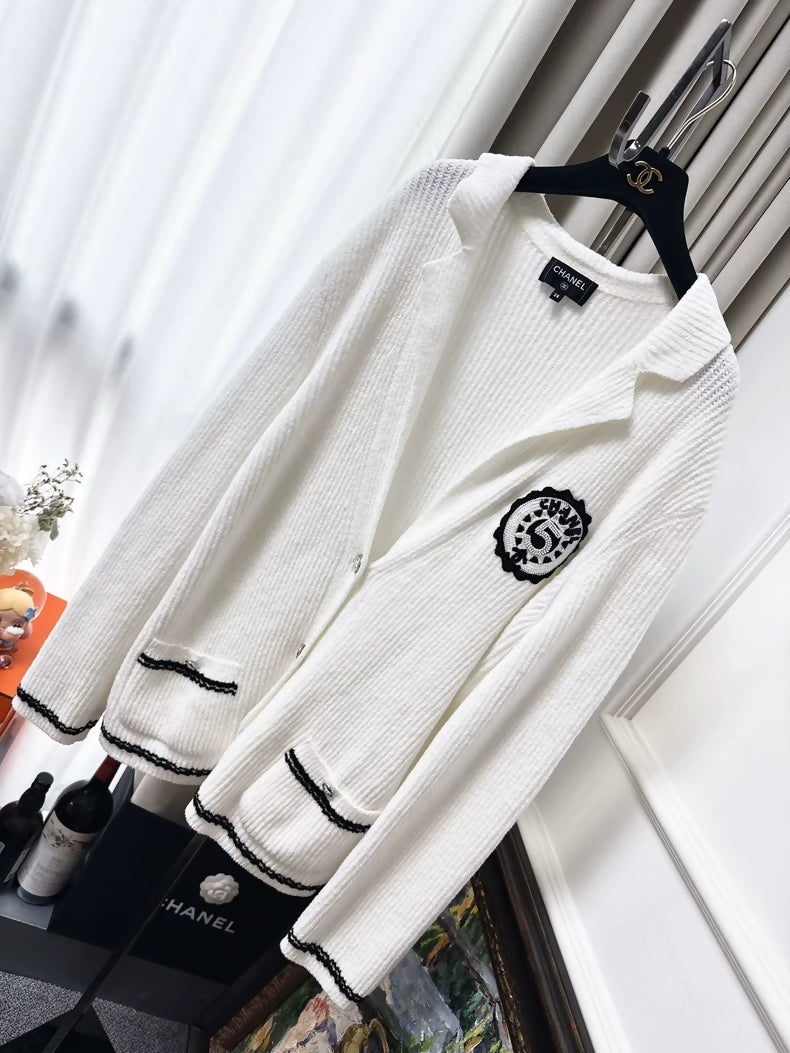 Chanel 23C white ribbed terry knit cardigan with black #5 beaded badge embroidered label
