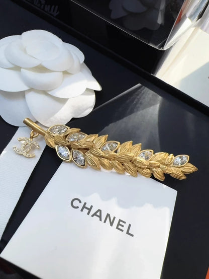 Chanel 20A gold rhinestone wheat logo pendant brooch