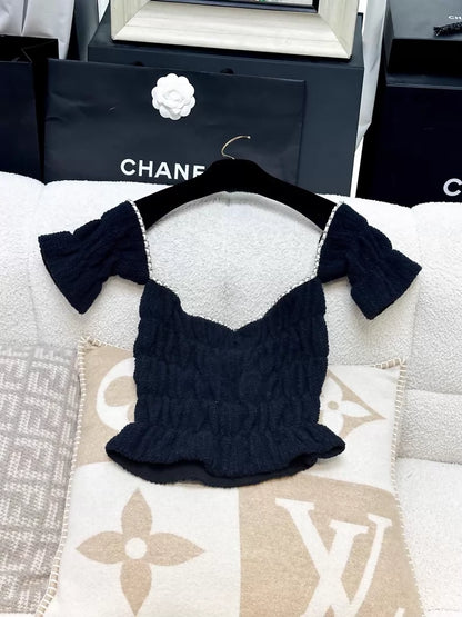 Chanel 21P off-the-shoulder top in dark blue gold chain leather
