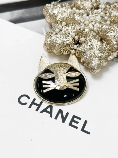 Chanel 19A black and gold double C logo cat brooch