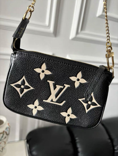 Louis Vuitton Bicolor Monogram Empreinte Leather Mini Pochette Accessoires