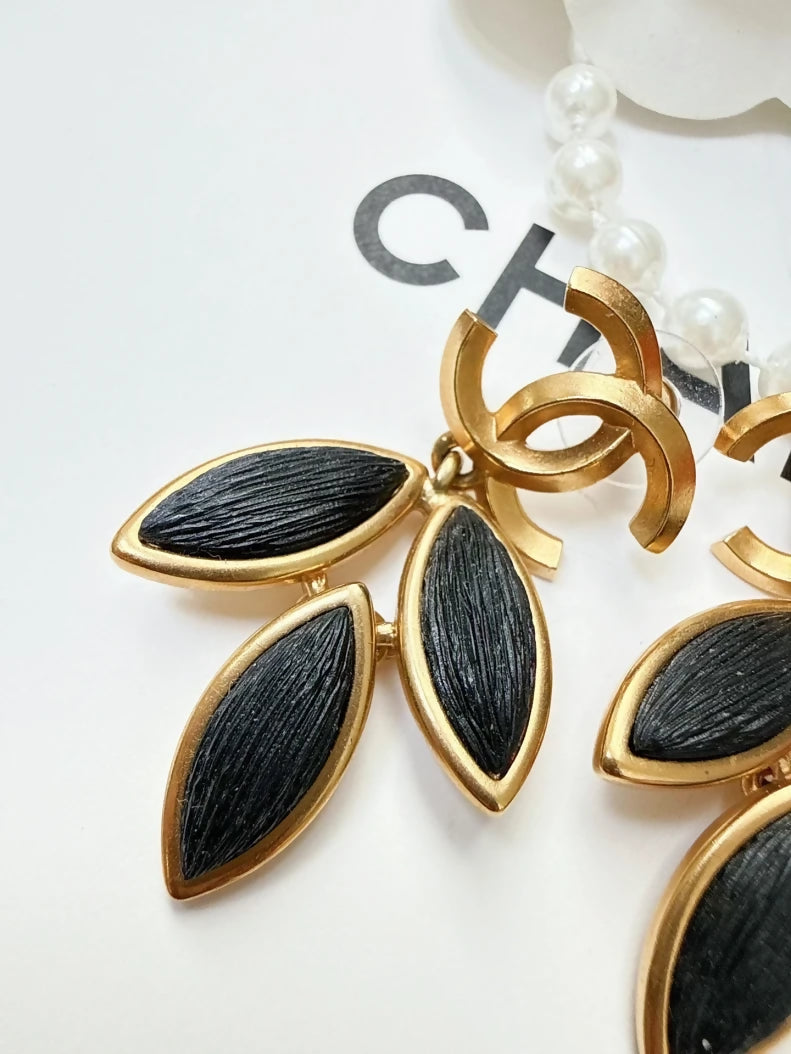 Chanel 20A Black and Gold Leaf Earrings with Double C Design