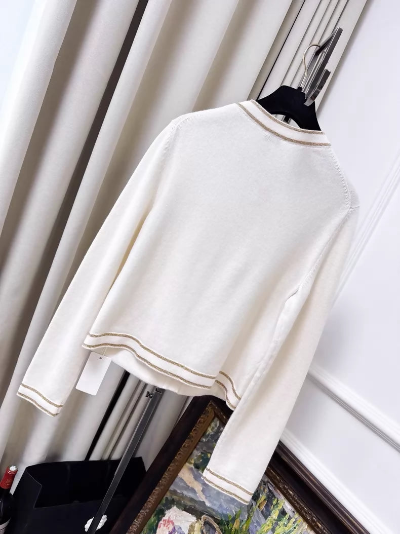 Chanel 26c white knit cardigan with gold trim and two pockets
