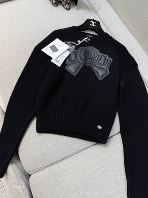 Chanel 20k black leather camellia bow knit top