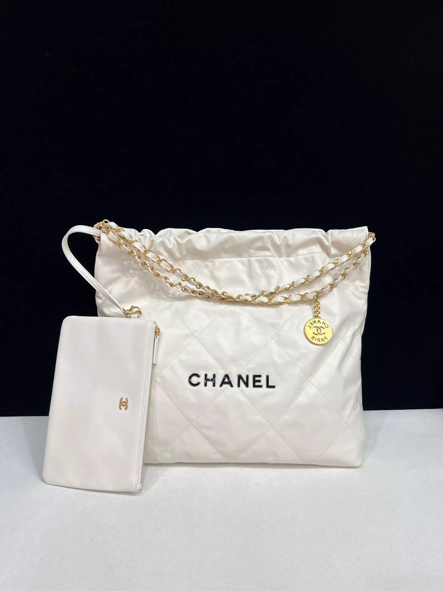 CHANEL 22 bag, white with black lettering, medium size
