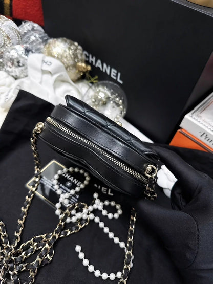 Chanel 22S black and gold quilted heart-shaped crossbody bag