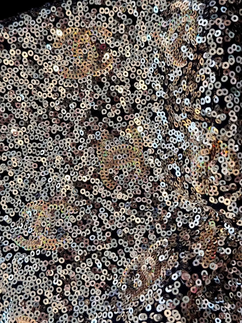 Chanel's 2024 early spring collection black and gold sequined knitted hooded jacket