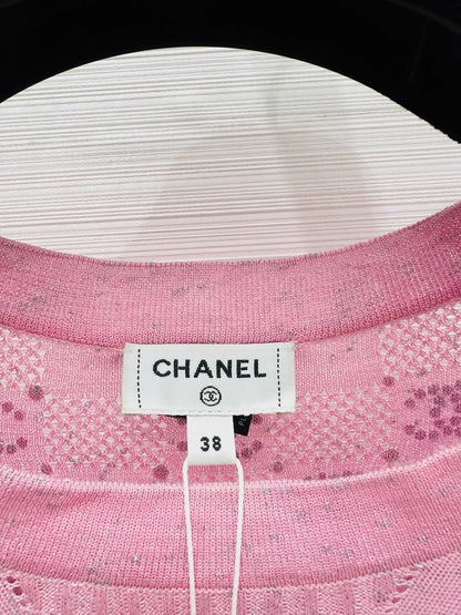 Chanel 23p pink top adorned with CC logo and rhinestones