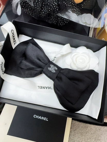 Chanel 25k black bow hairpin