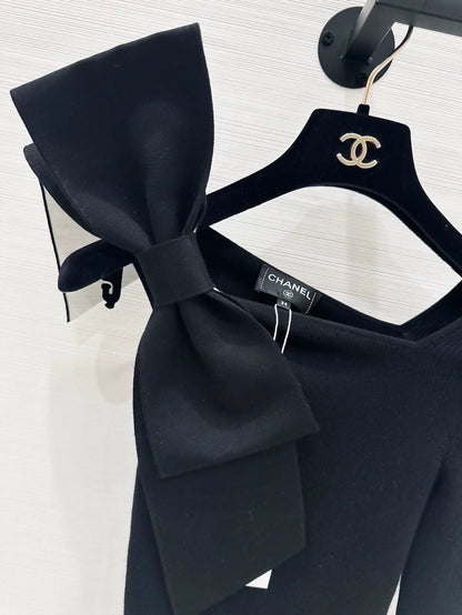 Chanel 25K black off-the-shoulder Bow top