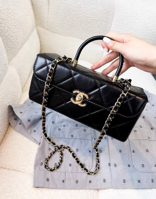 CHANEL Chanel 23K waxed leather black gold long vanity bag - Medium Crossbody Bag - Vintage fashion from Wararni