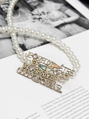 Chanel 22B  gold openwork logo brooch