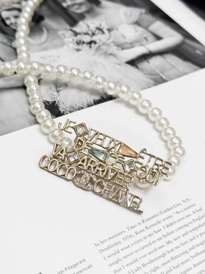 Chanel 22B  gold openwork logo brooch