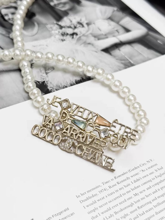 Chanel 22B  gold openwork logo brooch