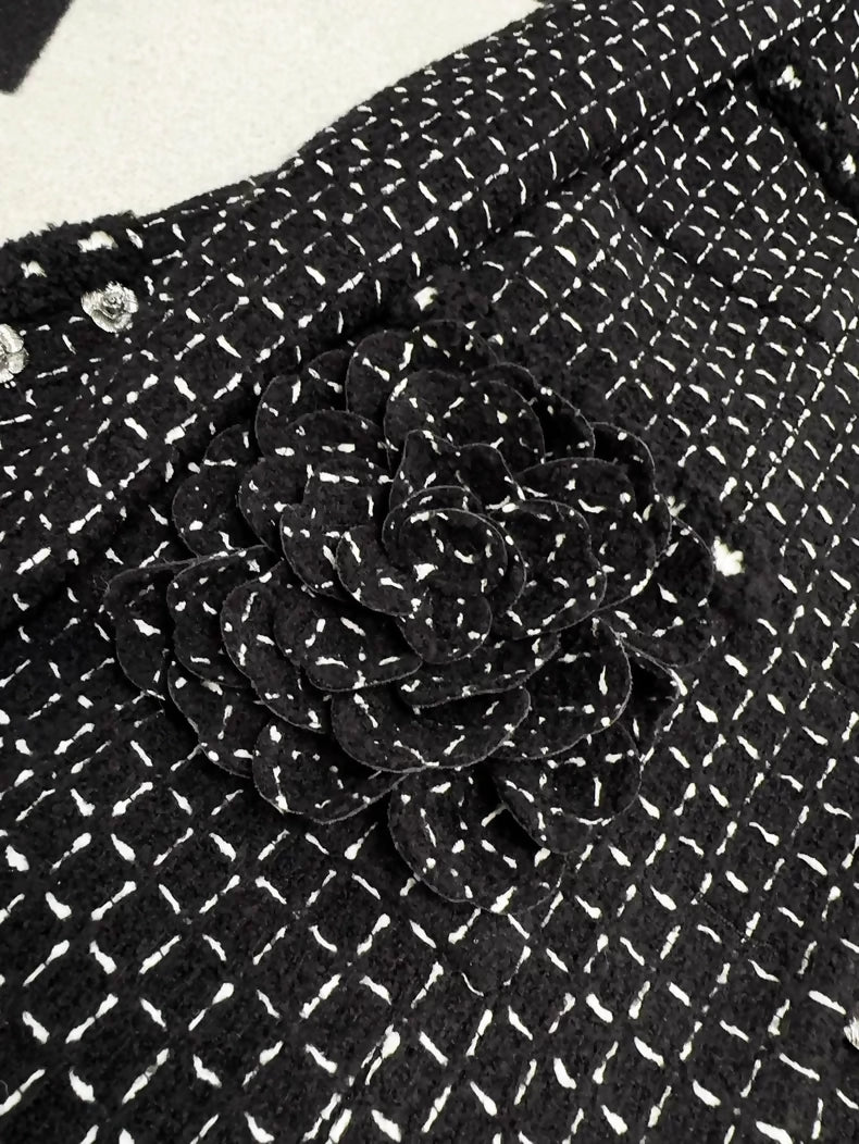 Chanel 23K black tweed jacket with white stitching