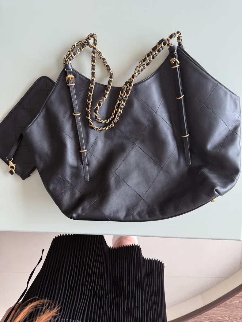 Large black and gold Chanel 25 hobo bag