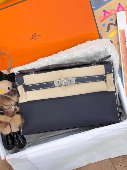 Hermès Kelly Pochette Black Swift leather with white stitching palladium hardware