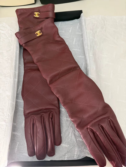 Chanel 26A burgundy backpack with buckle and leather gloves, size 7.5.