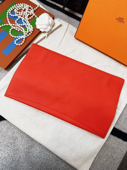 Hermes Pochette Pliplat red clutch