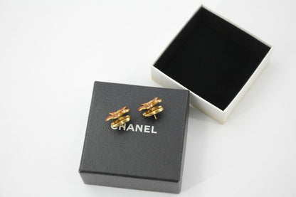Chanel 03P Enamel Orange Five-Petal Flower Green CC Stacked Earrings