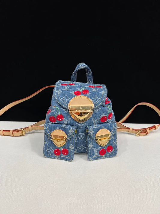Louis Vuitton Takashi Murakami collaboration cherry denim backpack