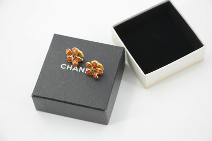 Chanel 03P Enamel Orange Five-Petal Flower Green CC Stacked Earrings